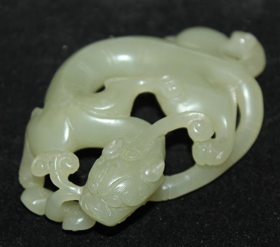A Chinese celadon jade carving of a chi-dragon biting a sprig of lingzhi fungus, Qing dynasty, 6.9cm